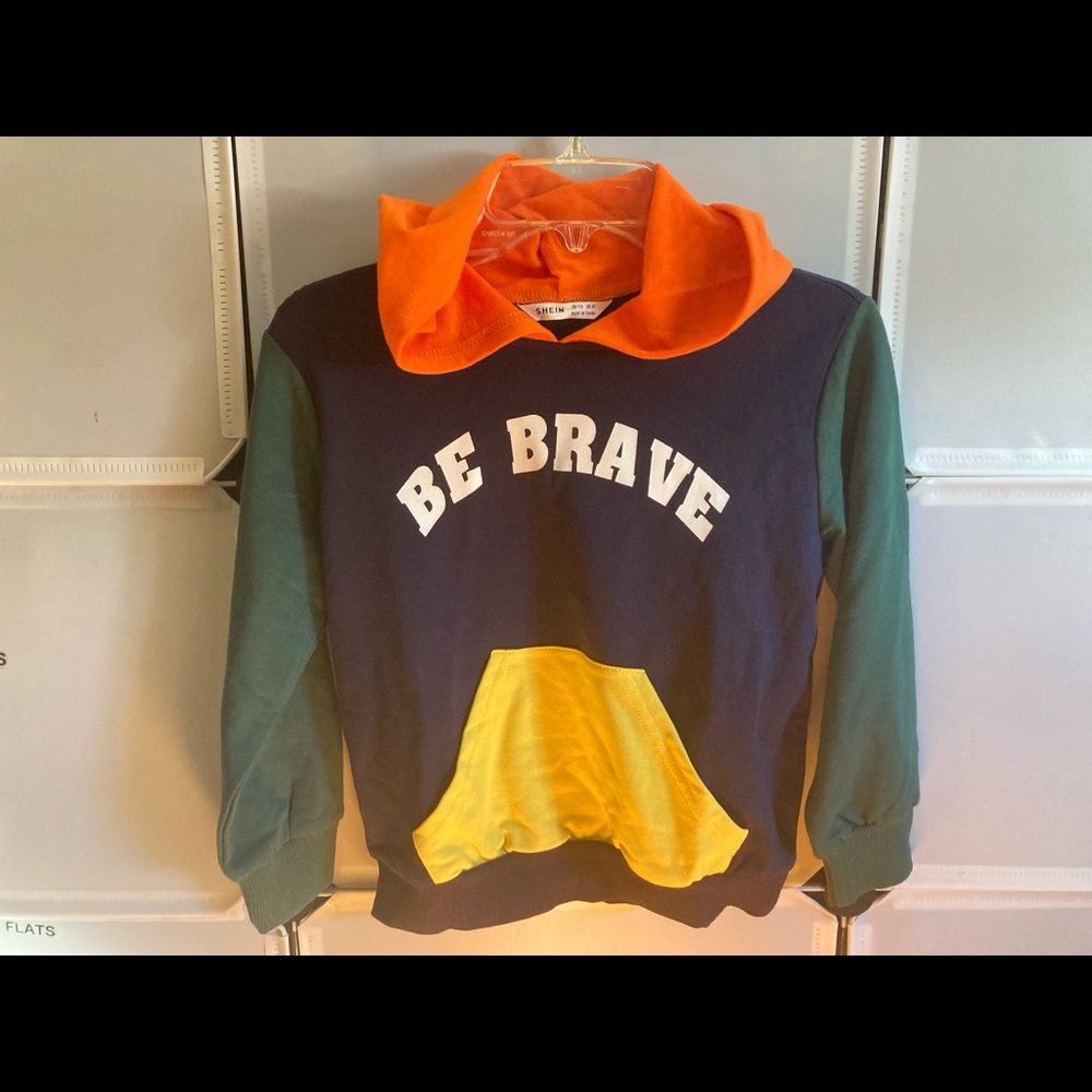 Multi colored hooded long sleeve shirt.